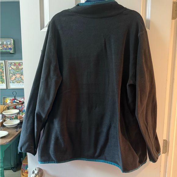 cotopaxi Black Fleece Pullover with Blue Chest Stripe and Red Snap Placket - Picture 2 of 3